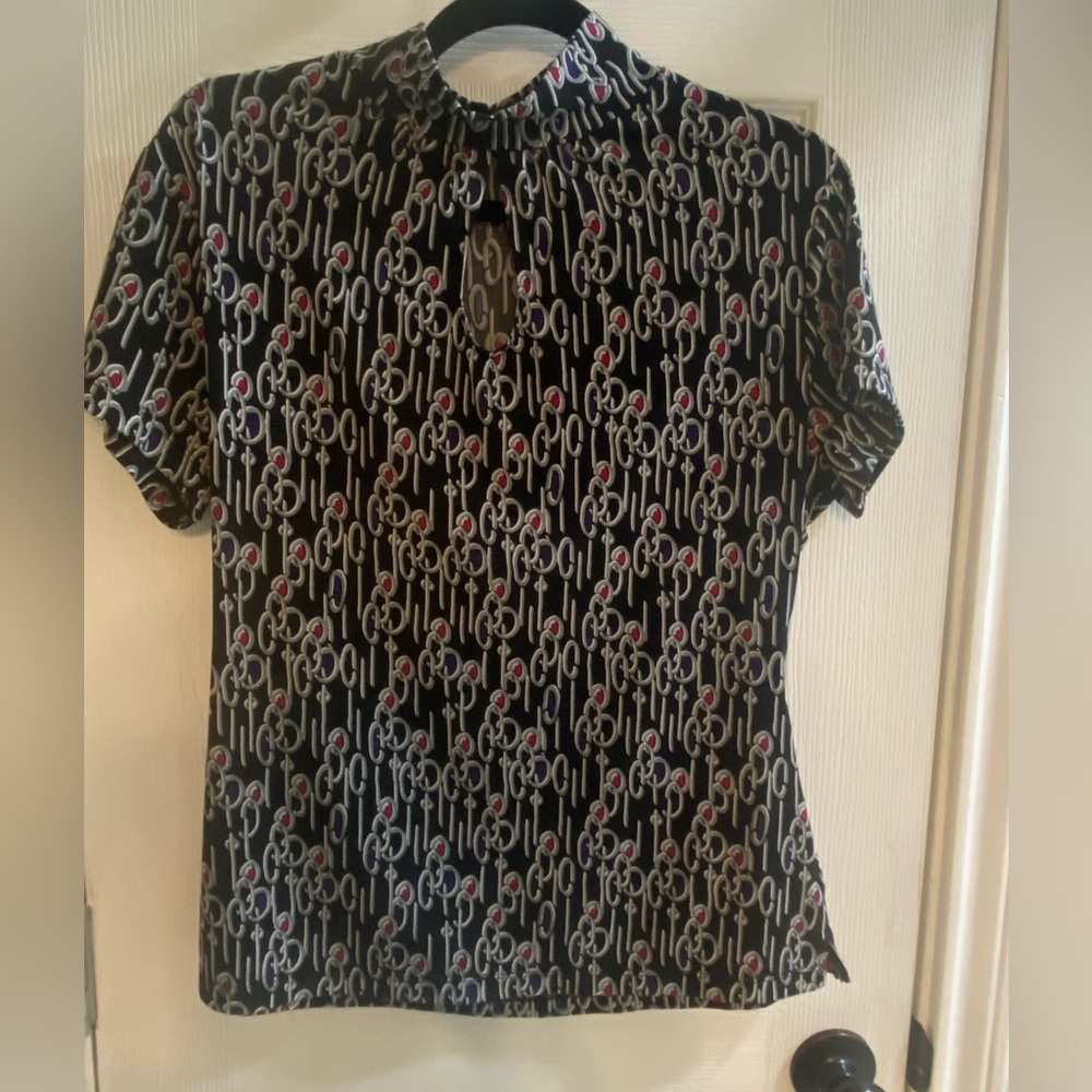 JCPenney-Black top with designs colors of gray, purple,white, deep pink